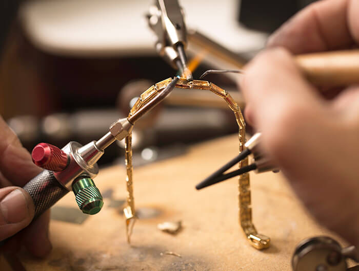 Jeweler Fixing a Bracelet