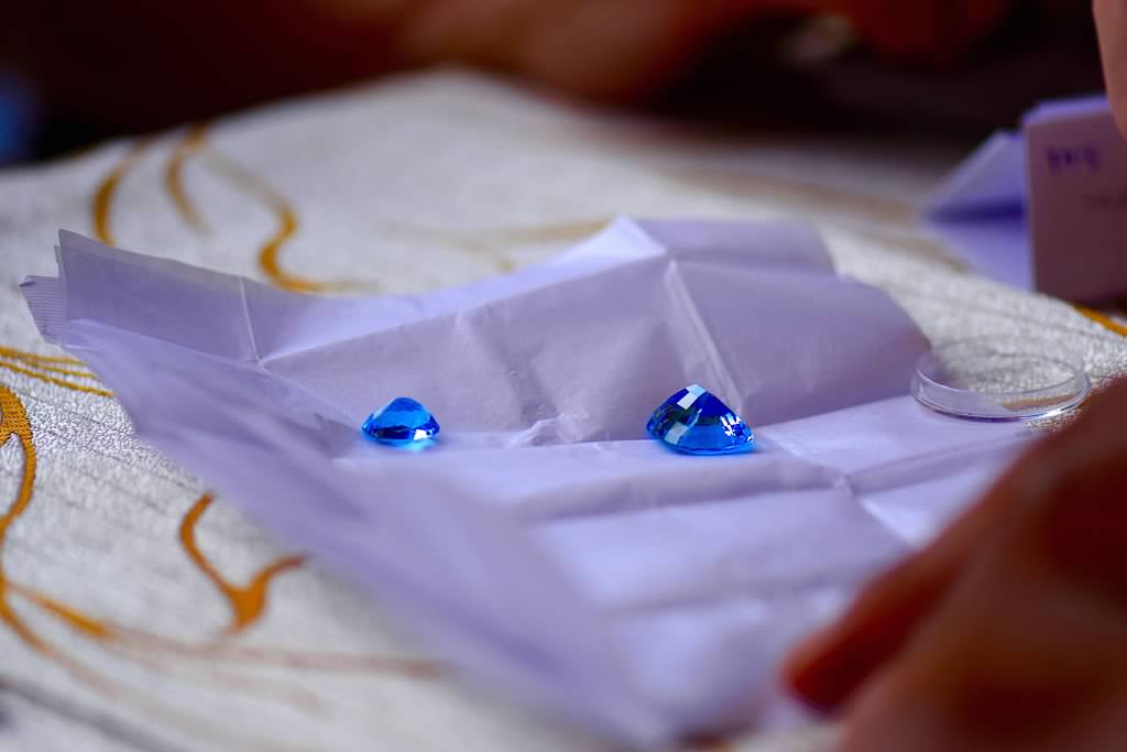 Loose blue sapphire in paper